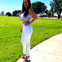 Pamela Millan, OnlyFans Model in White Outfit Poses for Stunning Shot