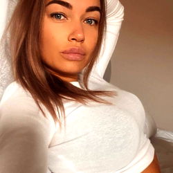 Anastasia London, OnlyFans Model, Reclining in a Tank Top