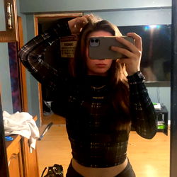 Model Amber Showcasing her Style in a Bathroom Mirror