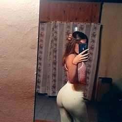 Model Selfie in Mirror with Blurred Background