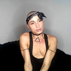 Jona, a Model Sitting and Posing in Her OnlyFans Photoshoot