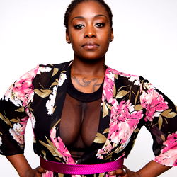 Aahnyx Stone, Model in a Floral Blouse and Belt