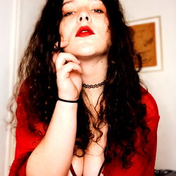 Amelatonine: Unfiltered Beauty, Amidst a Red Embrace