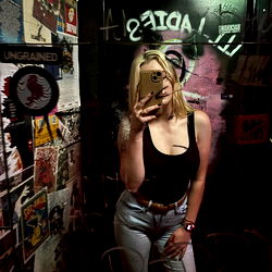 Brisbane-Based Model Miss Jess Captures Stylish Moment in Nightclub