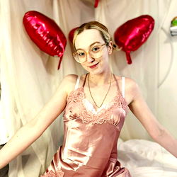 Kate, an OnlyFans model posing in a bedroom