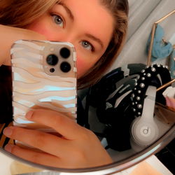 A Woman Taking a Mirror Selfie