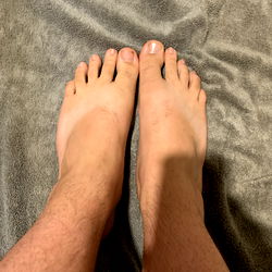 Model AB from Michigan Showcasing Foot Care with Bare Feet