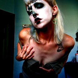 Futuristic Model with Heavy Eye Makeup and Tattoos