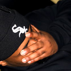 Person in black beanie with Chicago White Sox logo