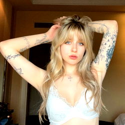 Model in white lingerie posing for the camera