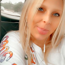 Fashionable Female Model with Blonde Hair and Tattoos