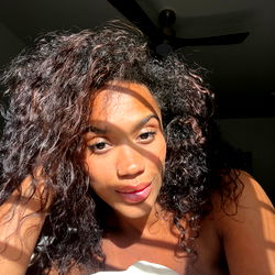 OnlyFans Model Princess Leaning on Pillow with Curly Hair