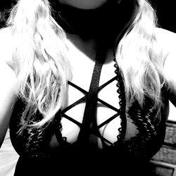 Sensual OnlyFans Model in Seductive Dress Posing for Photos