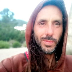 Gentleman in hoodie taking selfie