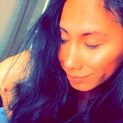 Woman with Long Hair Resting Her Head on Her Arm