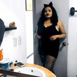 A Model Posing in a Bathroom