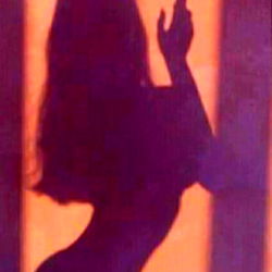 Model Angie Villa Showcasing Silhouette in Window