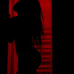 Silhouette of a Woman in a Doorway