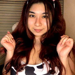 Aya, a Model from Japan in a Cow-Themed Bikini, with Ears and Bangs.