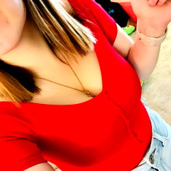 Abby - OnlyFans Model in Red Top, Smiling at Camera