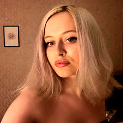 Stylish OnlyFans Model MAGGIE poses with a playful expression