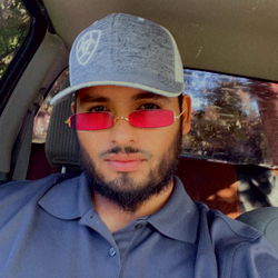 Man in Gray Hat Posing for Selfie