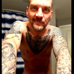Shirtless Man in Tattooed Chest