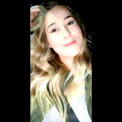 Beautiful Young Woman with Gorgeous Blonde Hair and Eyes, Capturing a Moment of Serenity