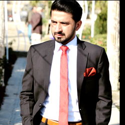 Formal Businessman Walking in an Outdoor Setting