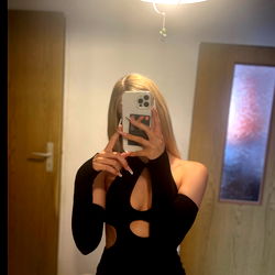 Caityx in a Stylish Black Dress with High Splits