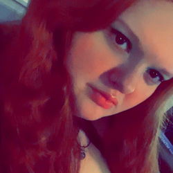 Red-haired woman in a cozy setting