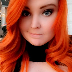 Stylish Red-haired Woman Smiling