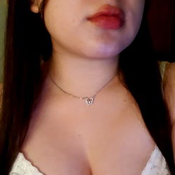 Model Showcasing Her Chest and Necklace in a Close-up Shot