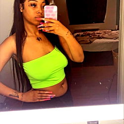 Model in Vibrant Tank Top Posing for Selfie