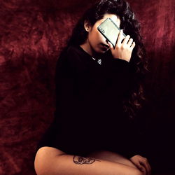 Alejandra, a 20-year-old model with tattoos