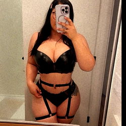 Model in Lingerie with Tattoos and Suspenders