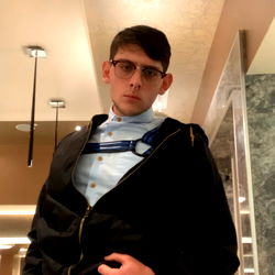 Stylish Model Noah Valentine in a Fashionable Jacket and Glasses