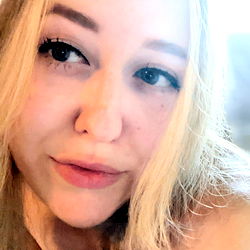 Blonde Woman Smiling at the Camera