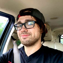 Smiling Man in Car with OnlyFans Model Name