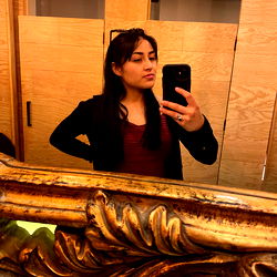 Abigail Peña capturing a moment in the mirror