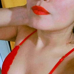 Model in Red Dress Posing for Selfie