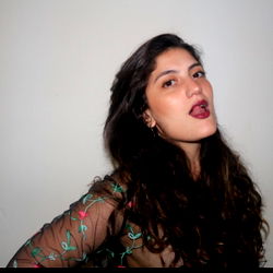 Mary Jane, a young adult woman with striking red lipstick and long wavy hair