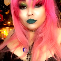 Empress Raven, A Model With Pink Hair and Colorful Makeup, From United States