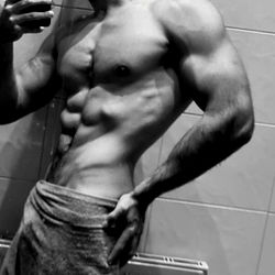 Fit Model Showcasing Physique in Bathroom