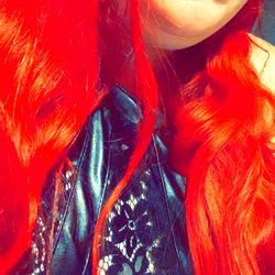 Red-haired woman with a surprised expression, tagged as #OnlyFans #Hampshire