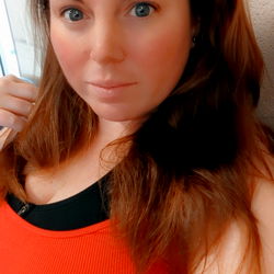 Sashley: A Confident and Fit Model Posing for a Photo