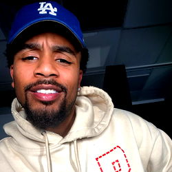Sports Fan in Baseball Cap with Beard and Nike Logo T-Shirt, Smiling at Camera