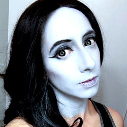 A Transgender Female Model with Blue Skin and Eyes, 25 Years Old