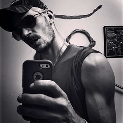 Fitness enthusiast's selfie with phone in hand