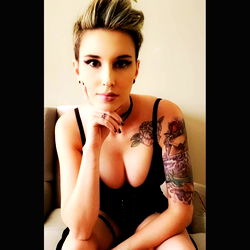 AconiteAngel, Tattooed Model with Piercings and Daring Style